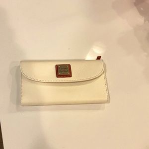 Dooney & Bourke cream/ bone colored clutch wallet